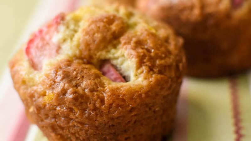 rhubarb muffins on a striped paper background